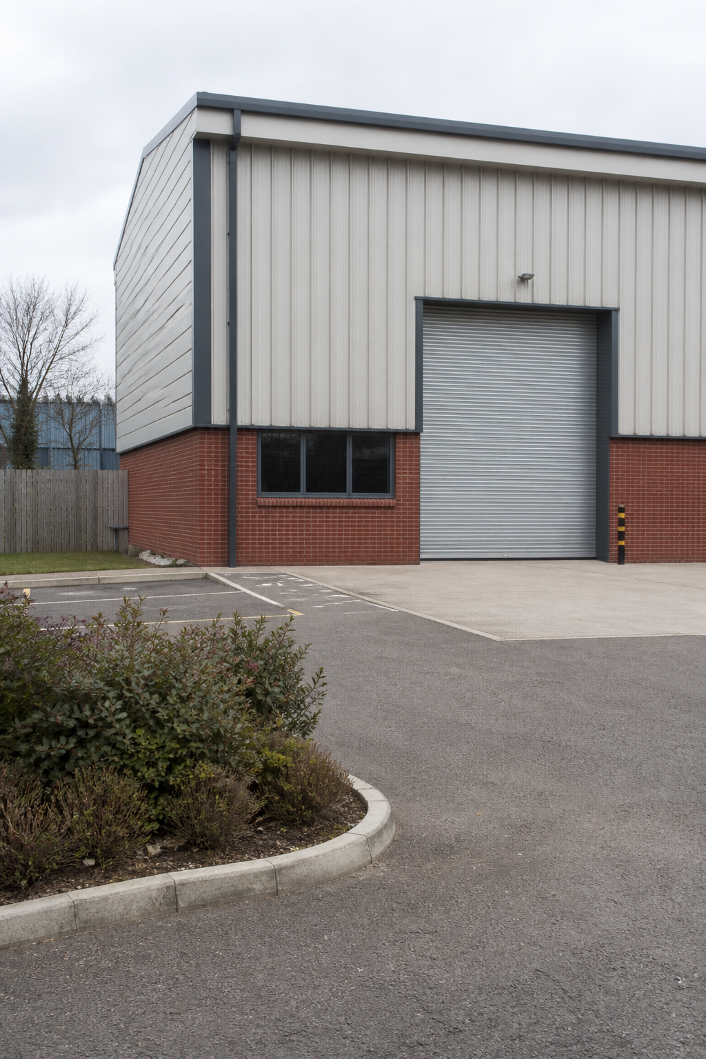 A contemporary industrial unit on an English business park, with no readable signs