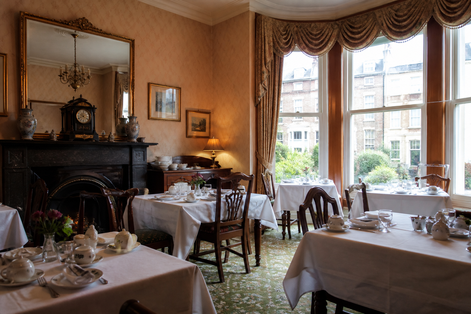 An empty Victorian breakfast room with white linen, with no menus and no prices